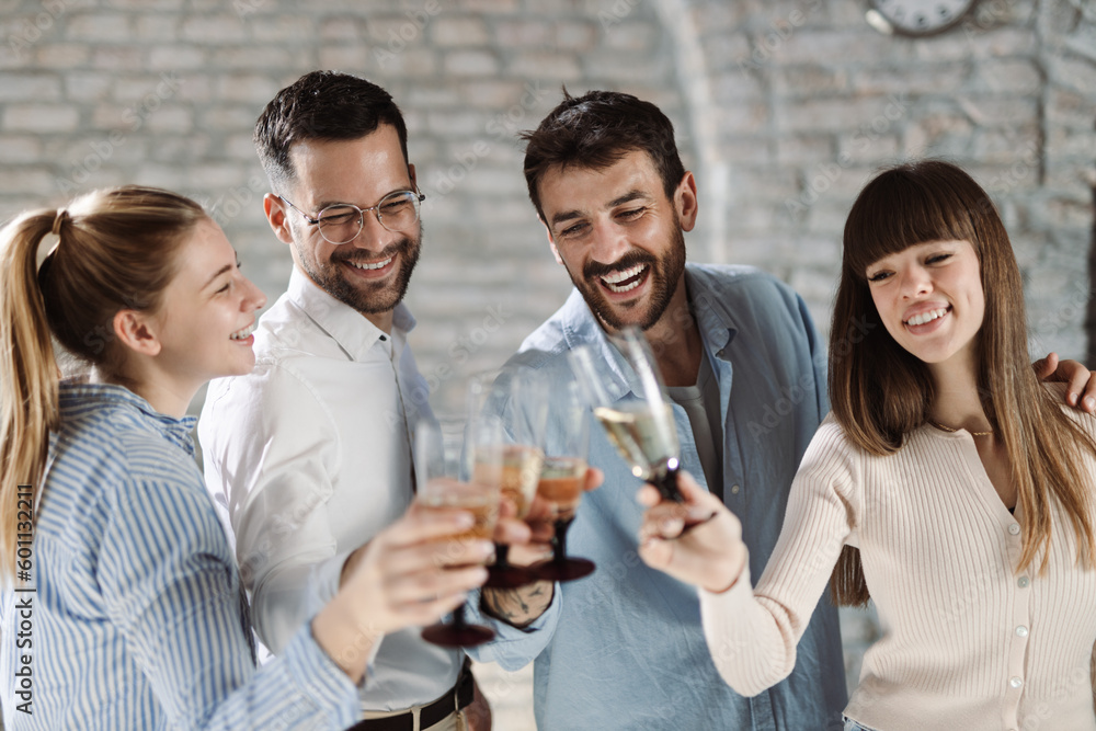 Group of happy business people toasting with wine at office party Group of happy business people toasting with wine at office party