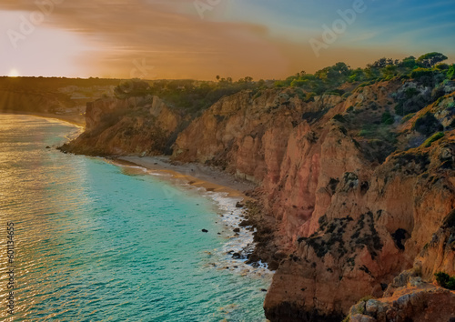 Ponta da Piedade (point of mercy) a headland with dramatic yellow-golden cliff-like rock formations, arches and grottos along the coastline of the town of Lagos, Algarve, Portugal