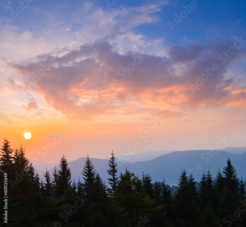 sunrise above mountain forest silhouette   early morning mountain scene