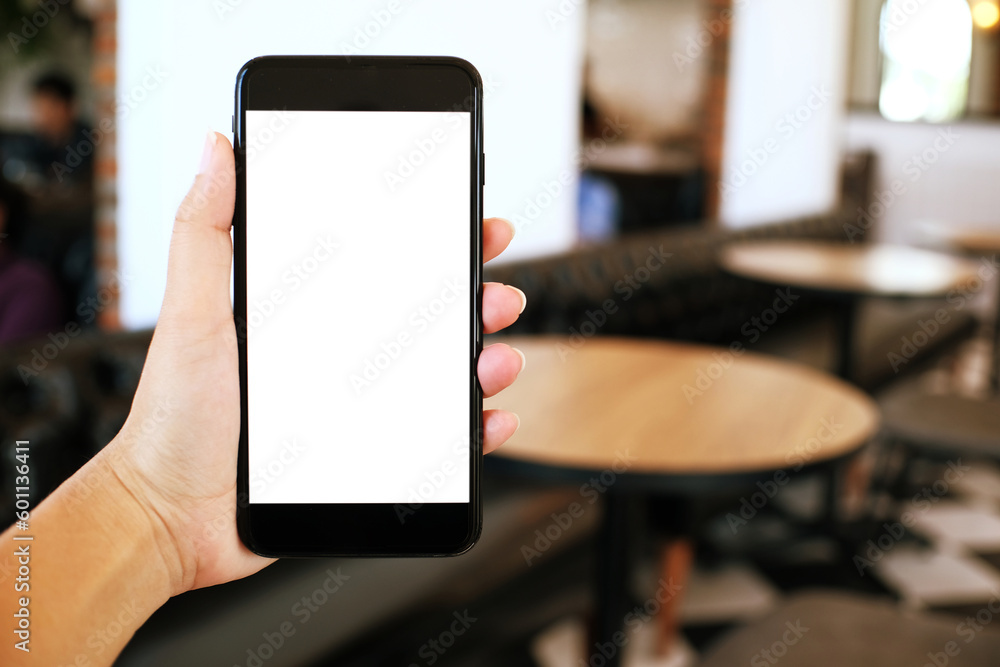 Close up of women's hands holding cell telephone blank copy space screen. smart phone with technology concept Close up of women's hands holding cell telephone blank copy space screen. smart phone with technology concept