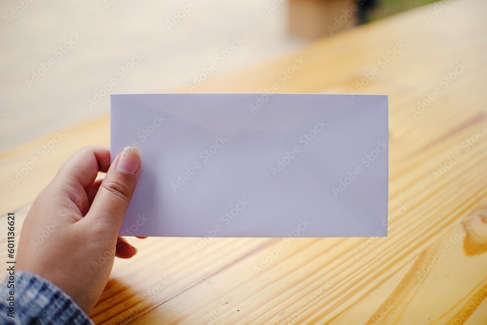 Woman hand hold the empty Envelope Letter Communication. Woman hand hold the empty Envelope Letter Communication.