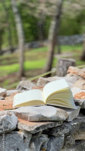 Wind Flipping Notebook Pages on nature background