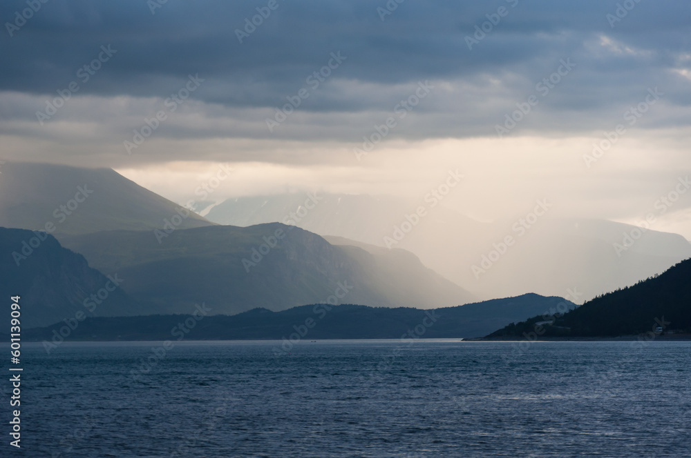 Misty mountain view over a fjord in northern Norway