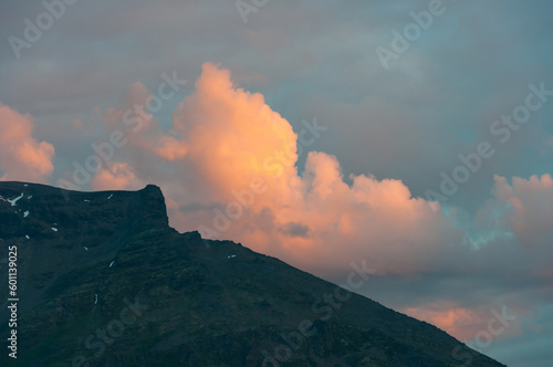 Clouds colored by sunset over a mountain in northern Norway