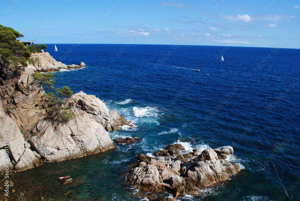 rocky coast of the sea in Lloret de Mar. Blue sky and sea