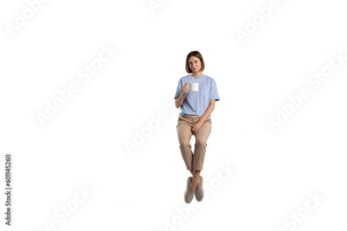 Girl sitting and holding a cup of hot coffee