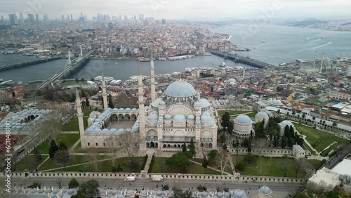Suleymaniye Mosque, Galata bridge and Halich, fly backward shot photo
