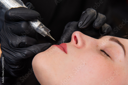 Eyebrow and lip correction procedures for facial rejuvenation in the beauty salon
