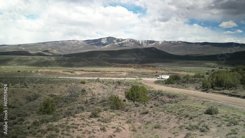 Aerial of truck driving through mountain landscape near Wolcott Colorado in spring time photo