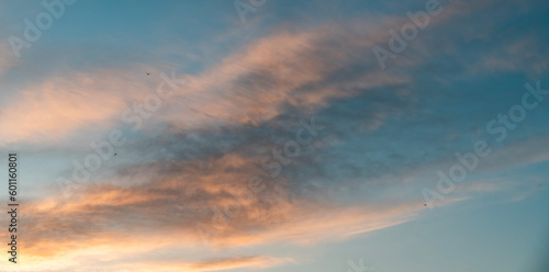 Beautiful bright summer sunset sky with clouds. Sunset sky clouds background. © Inga Av