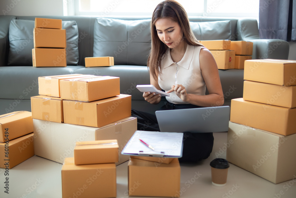 small sme entrepreneur is packing products into parcel boxes in preparation for transporting them to freight forwarder to deliver to customers with incoming orders. Concept Ecommerce Team online sales small sme entrepreneur is packing products into parcel boxes in preparation for transporting them to freight forwarder to deliver to customers with incoming orders. Concept Ecommerce Team online sales
