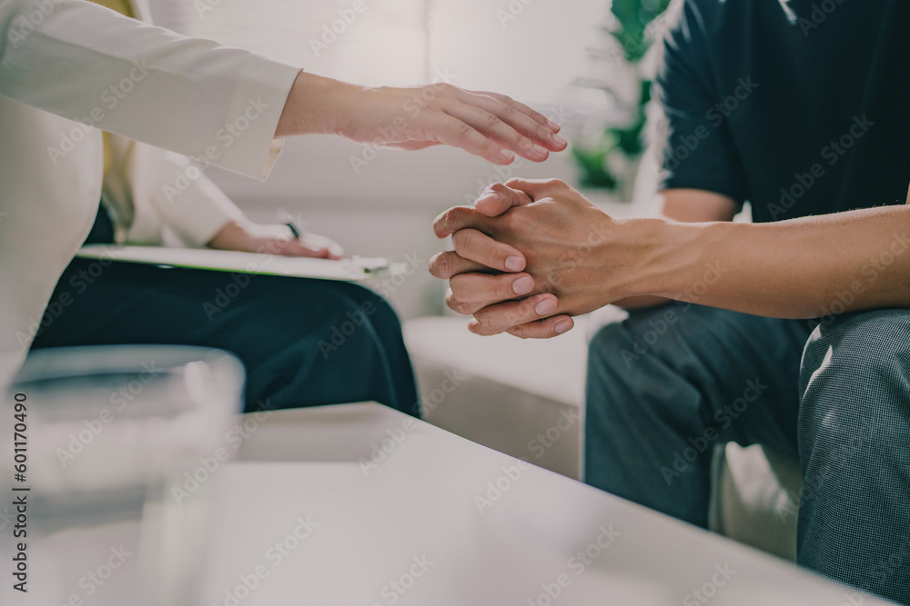 Psychiatrist hand holding her sad patient, Support and taking good care..