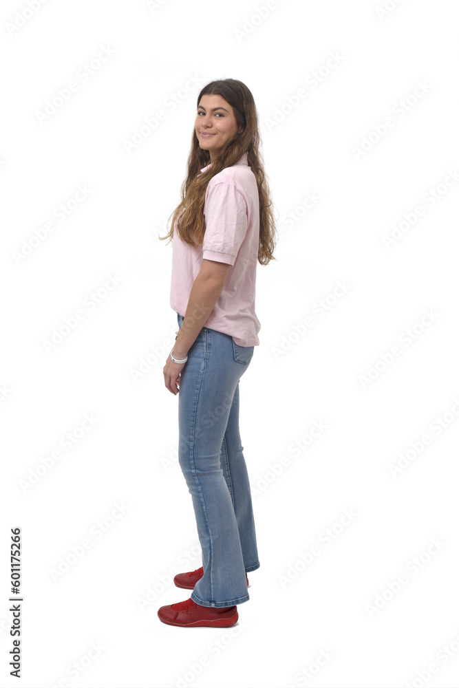 side view of a young girl standing and smiling and looking at camera on white background side view of a young girl standing and smiling and looking at camera on white background