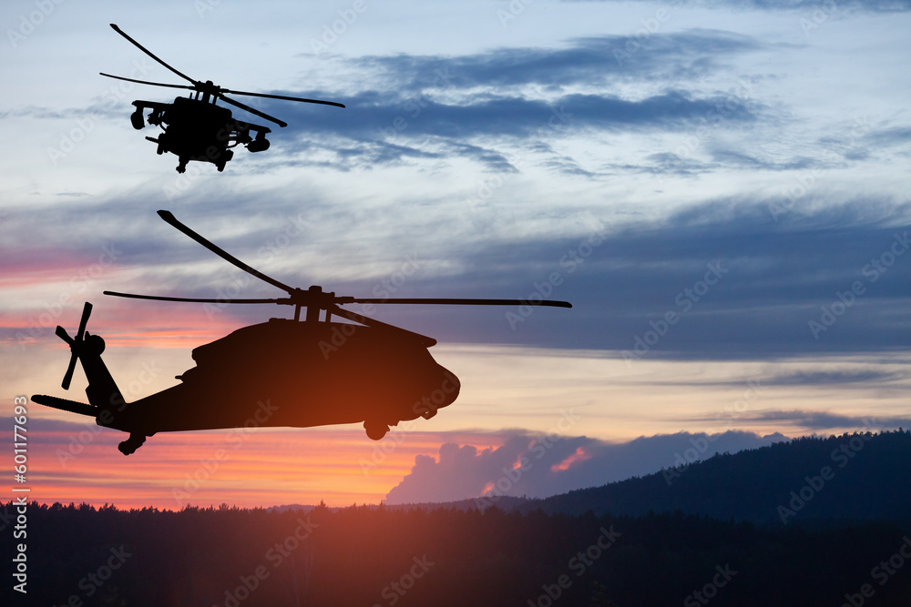 Silhouettes of helicopters on background of sunset. Greeting card for Veterans Day, Memorial Day, Air Force Day. USA celebration. Silhouettes of helicopters on background of sunset. Greeting card for Veterans Day, Memorial Day, Air Force Day. USA celebration.