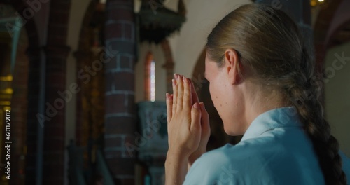 Fototapeta Woman praying to God with HOPE and FAITH in church