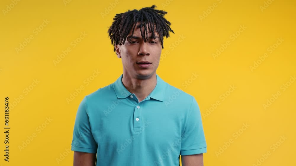 Young man disapproving signal with no head sign, nods head rejectingly. Young man disapproving signal with no head sign, nods head rejectingly.