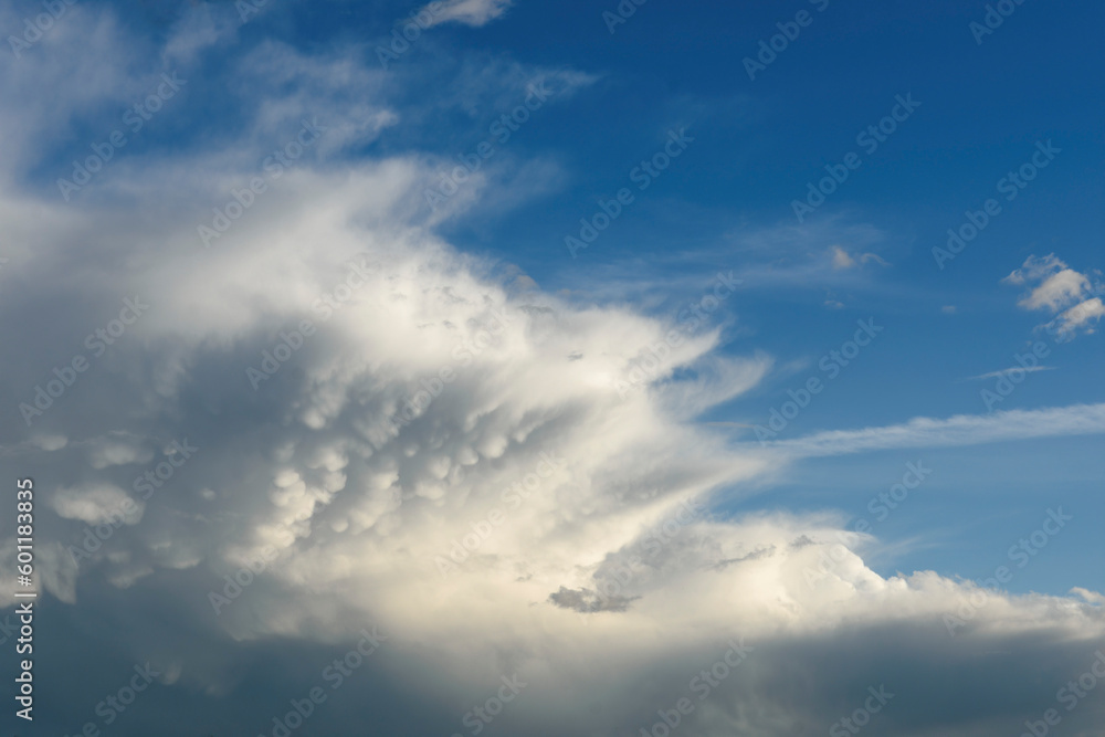 large fuzzy cloud in blue sky