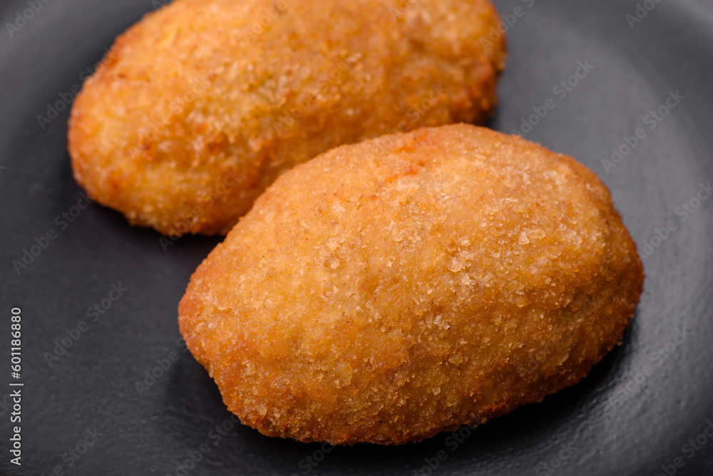 Delicious baked cutlet breaded with spices, salt and herbs Delicious baked cutlet breaded with spices, salt and herbs