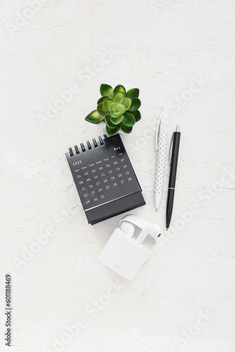 Flip paper calendar, earpho...