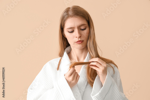 Young woman with hair loss ...