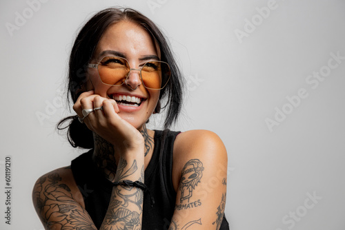 Tattoed Millanial woman laughing