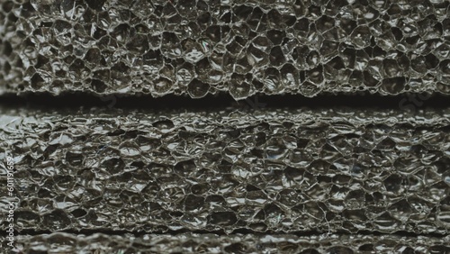 Abstract Black Porous Soundproofing Material Structure Macro Shot 