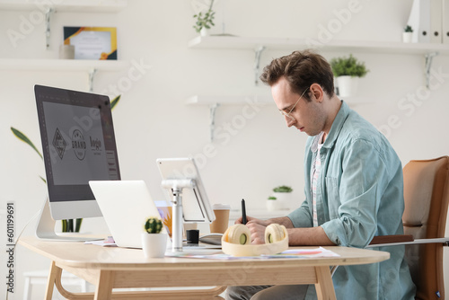 Male graphic designer devel...