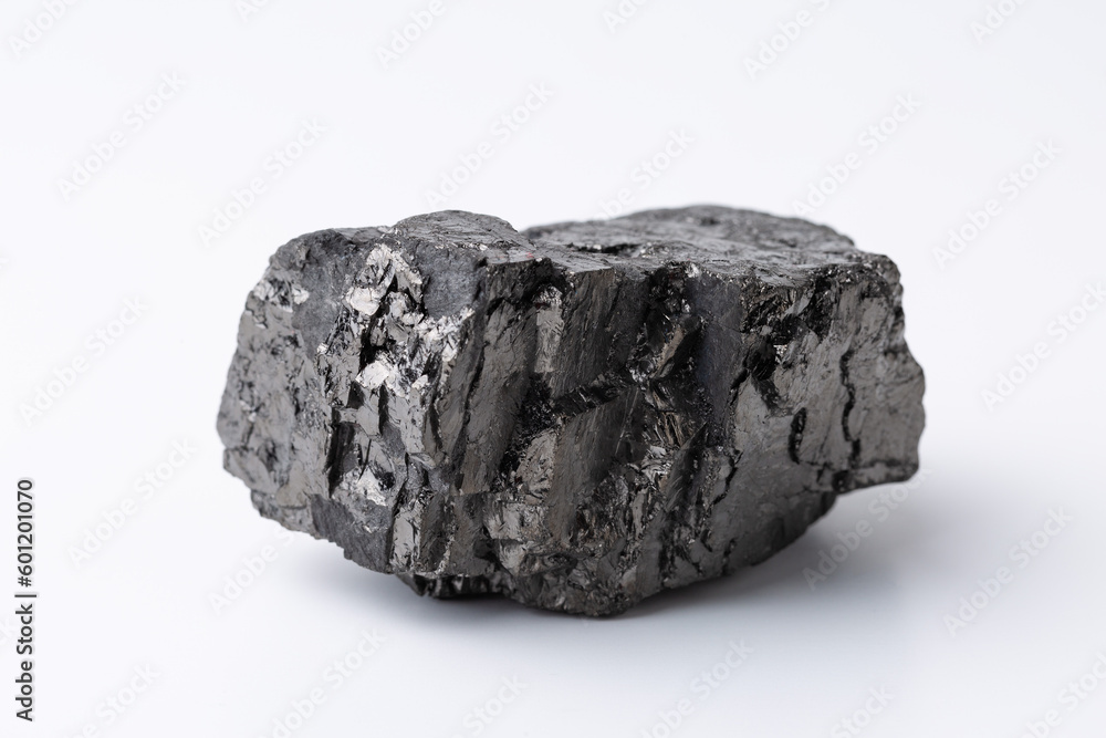 Natural black fossil coal on a white isolated background.