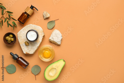Composition with natural cosmetics, ingredients and stones on color background