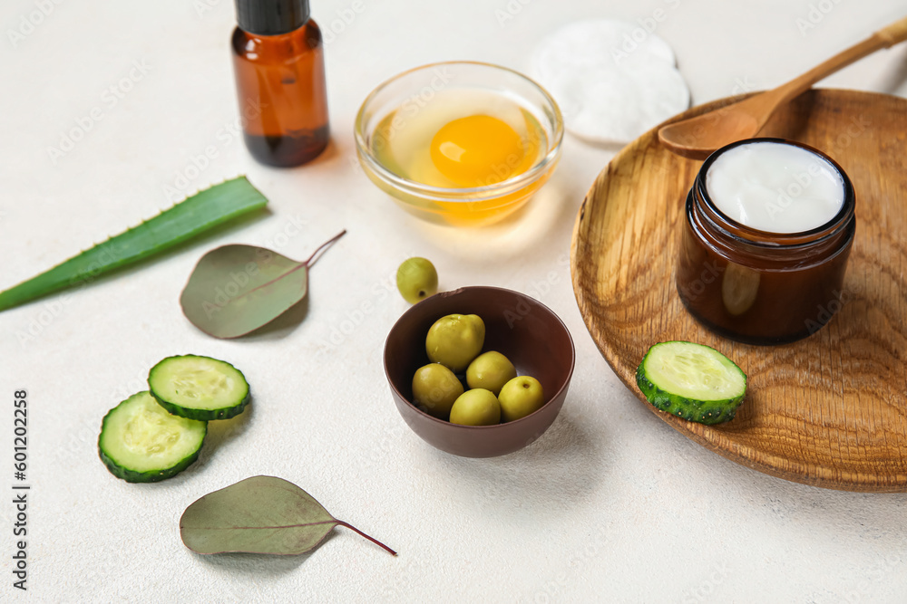 Composition with natural cosmetics and ingredients on light background Composition with natural cosmetics and ingredients on light background