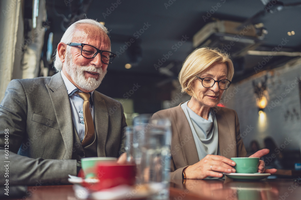Mature Woman and Senior Man couple Bond Over Coffee at Cafe sit talk