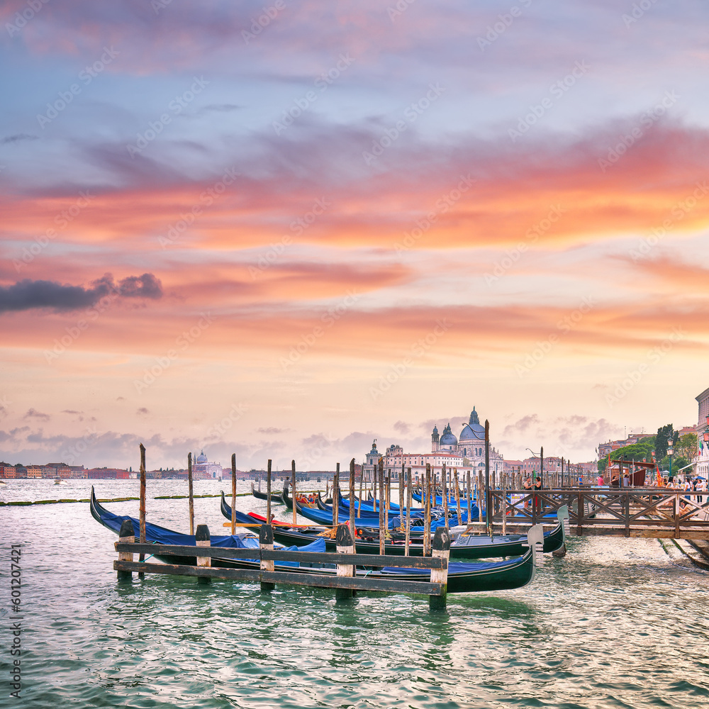 Captivating  landscape of Riva degli Schiavoni with parked gondolas in Venice. Popular tourist destination.