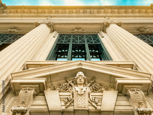 Looking up at the front door entrance to the Illinois Supreme Courthouse. in Springfield, Illinois, USA. Ornate architectural details and classical style columns reach to the sky. photo