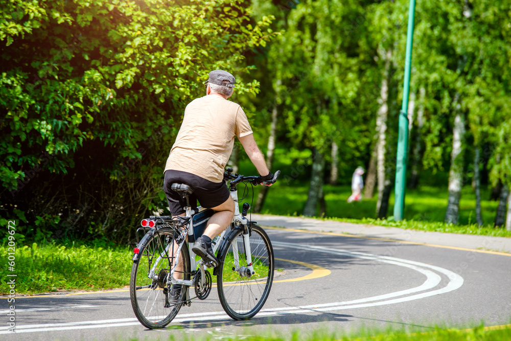 Cyclist ride on the bike path in the city Park
