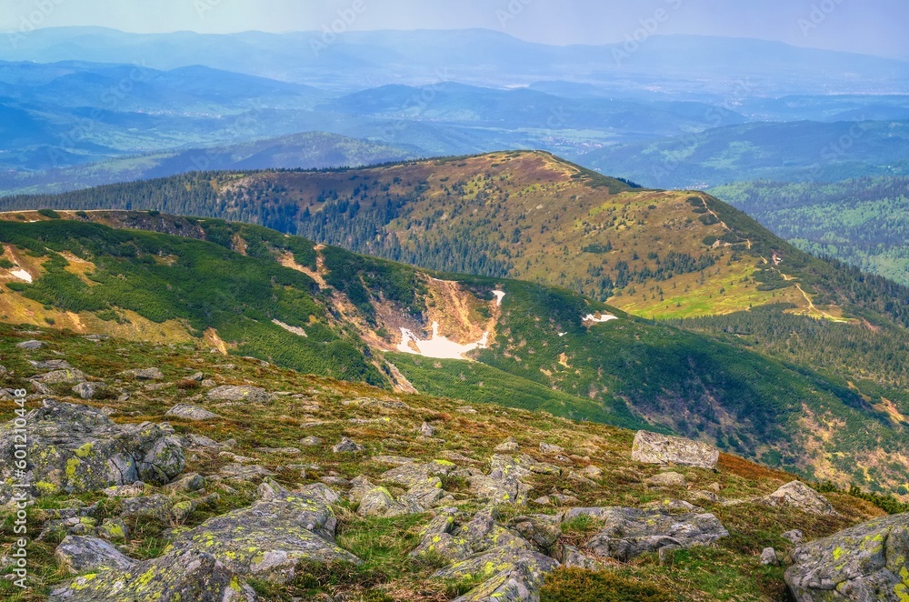 Mountain landscape in spring season. Picturesque view stretches of the highest peak in Beskids mountains (Babia Gora) over trail running the ridge, Poland.
