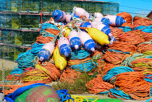 Canvas Print Bundles of commercial nylon woven fishing line orange, yellow, blue, and green in color