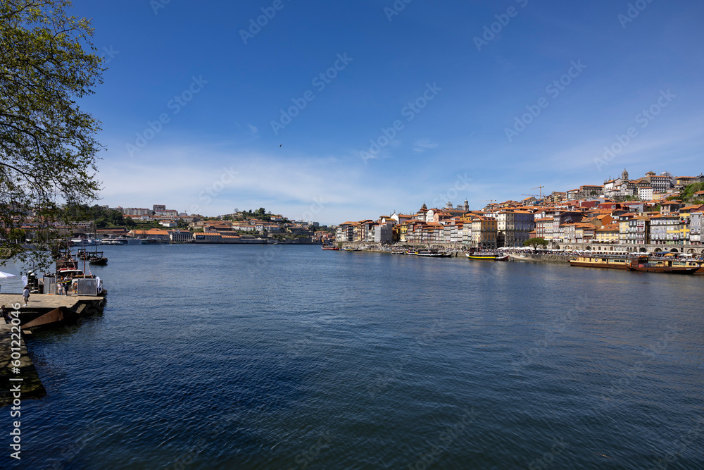 Panoramic view of Douro river and the cityscape of city of Porto in the background, Porto, Portugal