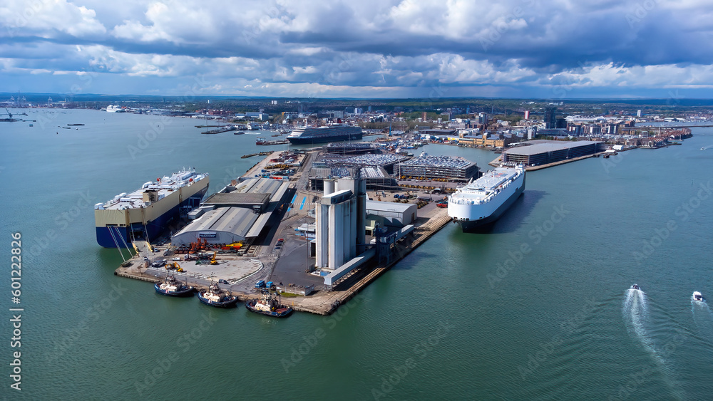 Ro-Ro ships unloading new cars in the Port of Southampton on the Channel coast in southern England, United Kingdom - Large polder used for international trade and shipping
