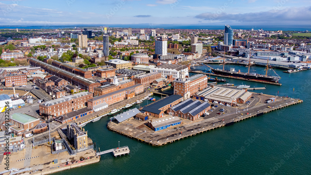 Aerial view of Portsmouth Historic Dockyard and the Royal Navy's ancient HMS Warrior warship on the English Channel coast in the south of England, United Kingdom