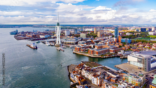 Aerial view of the sail-shaped Spinnaker Tower in Portsmouth Harbor in the south of England on the Channel coast - Gunwharf Quays modern shopping mall in a residential waterfront area photo