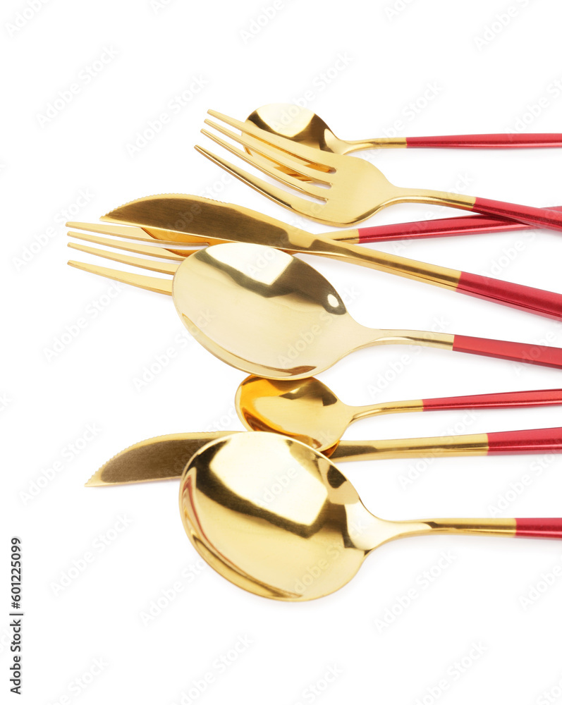 Golden set of cutlery with red handles on white background Golden set of cutlery with red handles on white background