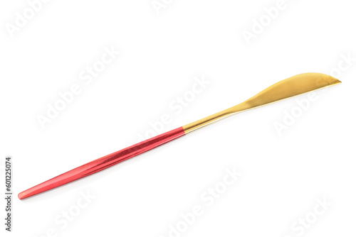 Golden knife with red handle on white background