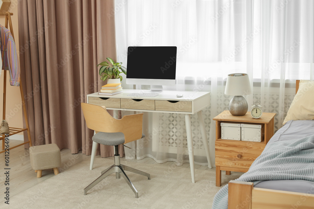 Fototapeta premium Stylish teenager's room interior with comfortable bed and workplace