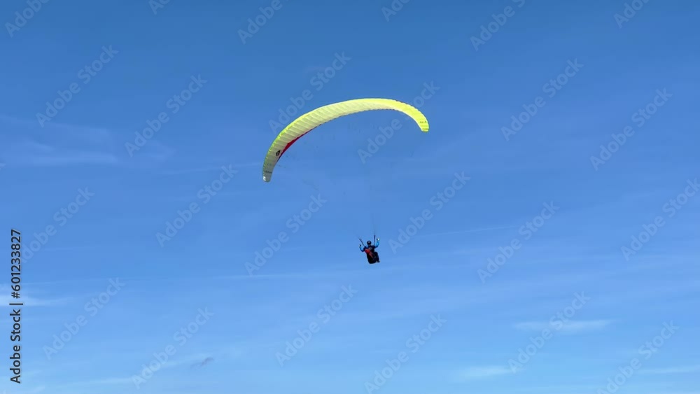 Paraglider in the mountains on a sunny day - travel photography Paraglider in the mountains on a sunny day - travel photography
