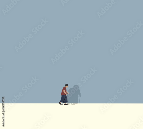Elderly woman with walking stick walking down street in countryside. Elderly and disability concept.