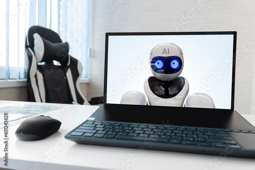 replacing a person with artificial intelligence. laptop with a robot on the screen. dismissal of employees and replacement by robots concept. neural network displaces workers.