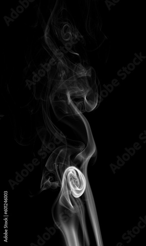 Fototapeta Naklejka Na Ścianę i Meble -  movement of smoke on black background, smoke background, abstract smoke on black background. Aromatic smoke coming out from Dhoop Cone