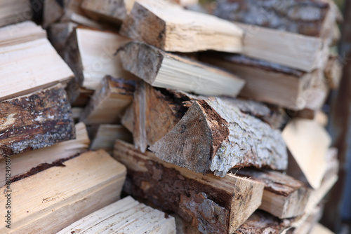 Stack of chopped wood logs for bonfire