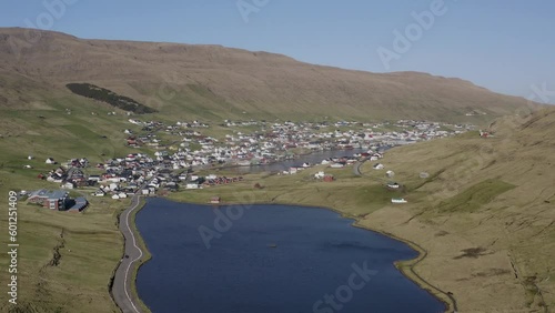 Panorama drone shot of Vagur town in The Valley on Suduroy island during sunny day - visiting Faroe Islands photo