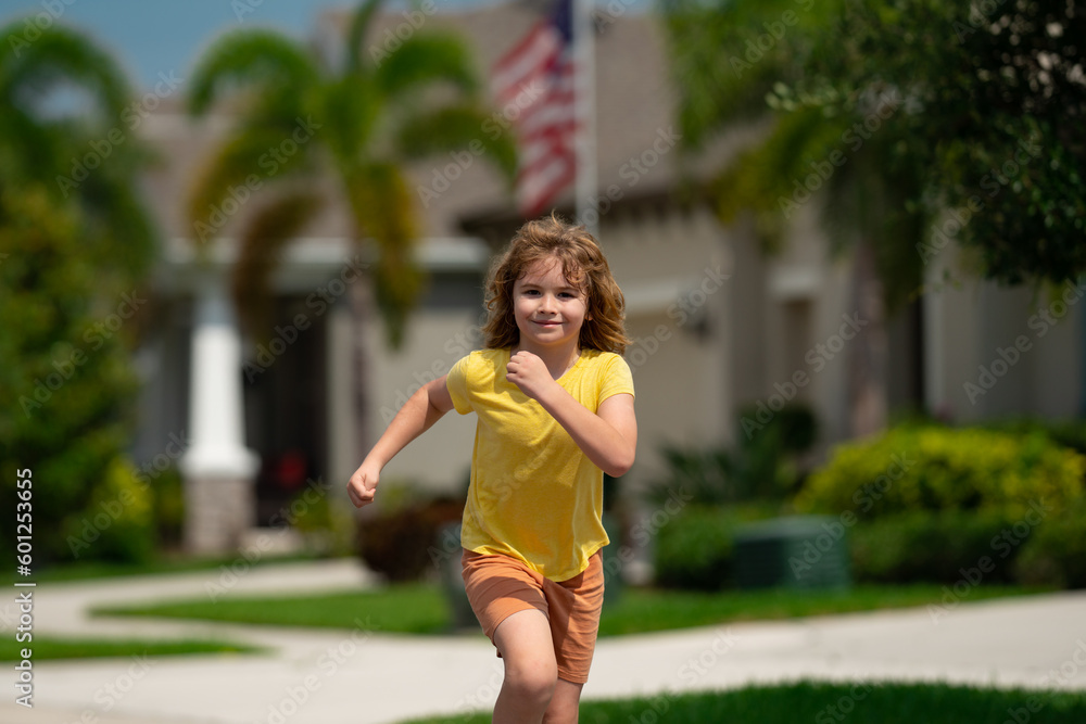 Child running in summer street. Kid enjoy run. Kid running on neighborhood. Kids run on city running road. Happy childhood. Child boy running in the park. Sports and fitness, exercise for kids.